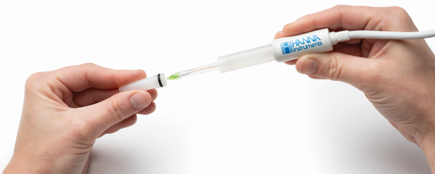 A Hanna pH electrode with the storage cap being placed on or removed from the electrode